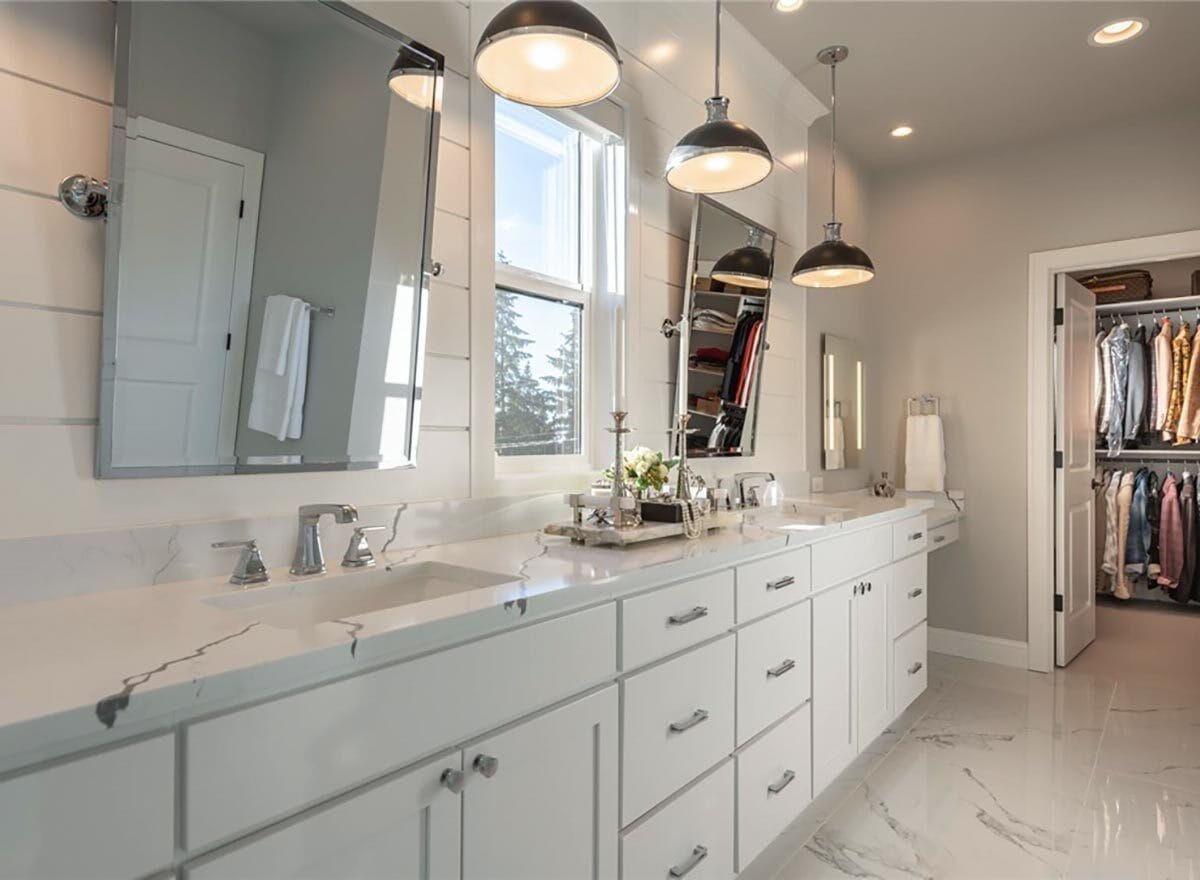 The primary bathroom includes a dual sink vanity and a walk-in shower.