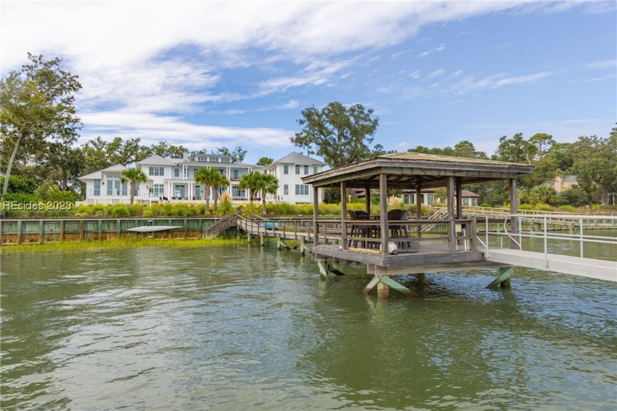 Dock with a boardwalk leading to the house.