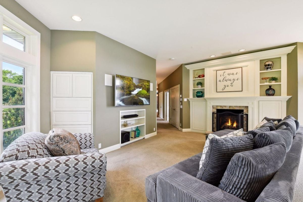 Sitting area with couches and a fireplace.