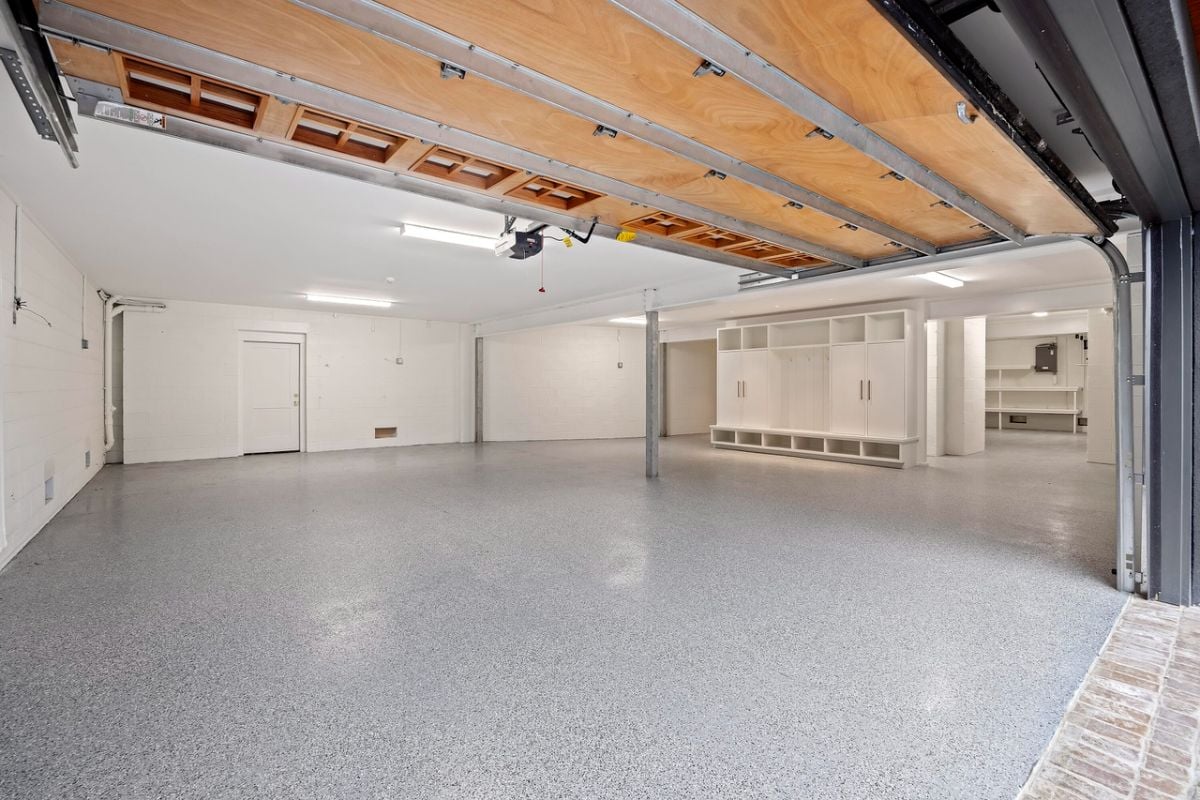 Spacious garage with automatic garage door opener.