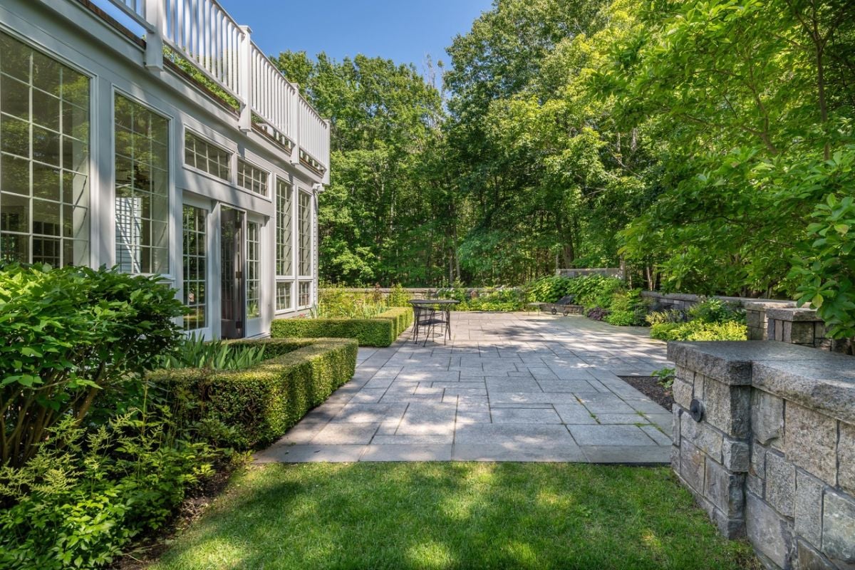 Patio surrounded by trees.