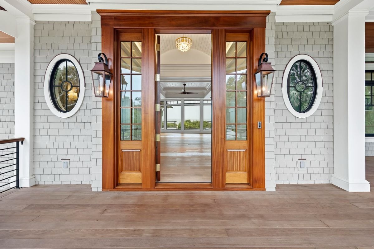 Front entry door of the house with a porch.