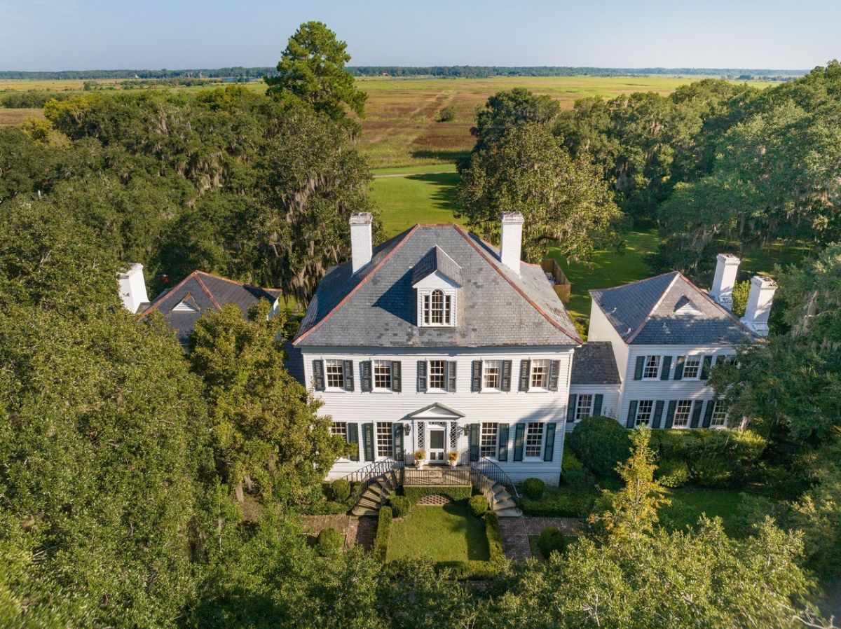 Aerial view of the property surrounded by trees.