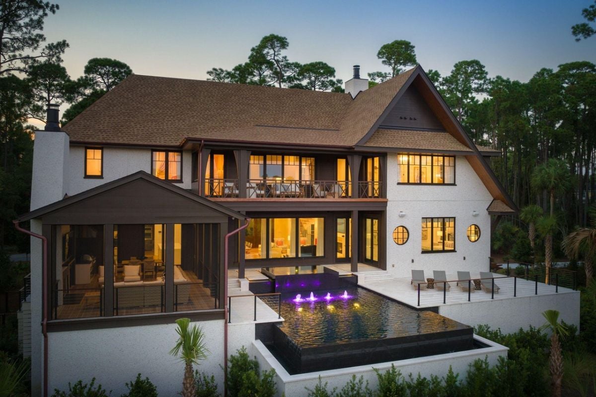 Rear view of the mansion with a pool.