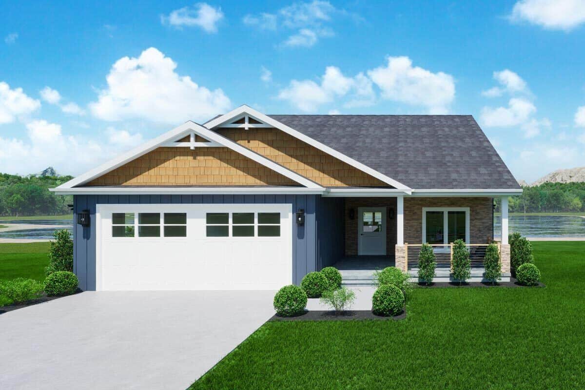 Front view with a double garage and a covered entry porch supported by stone base columns.