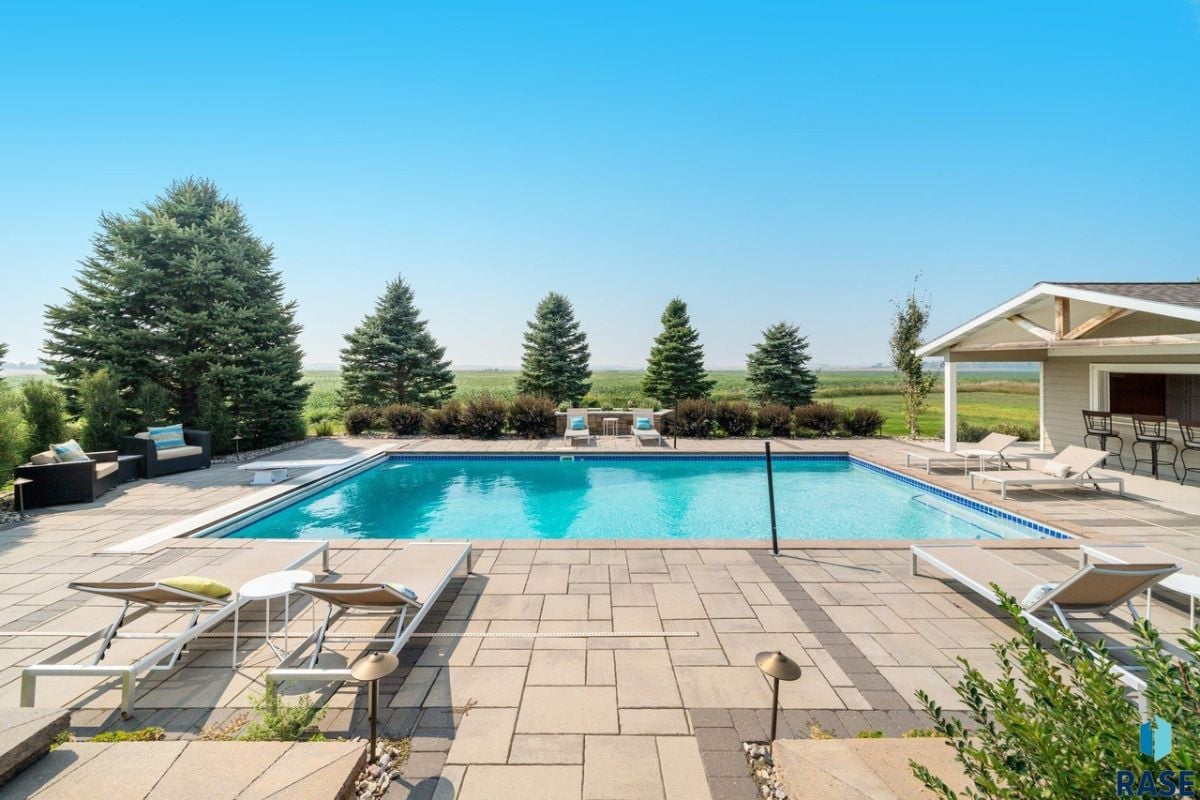 Pool with lounge chairs.