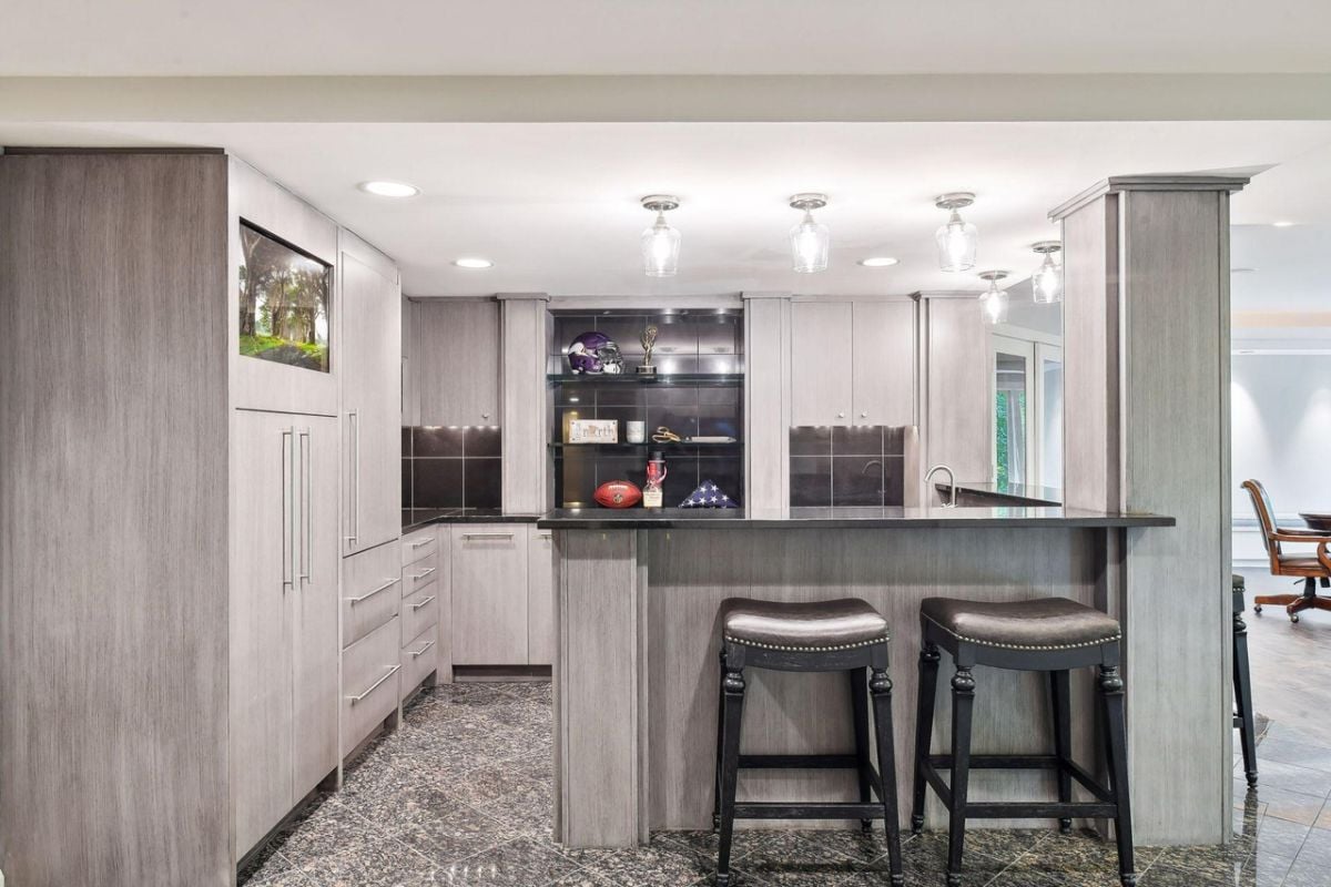 Bar with custom lights and custom cabinets.