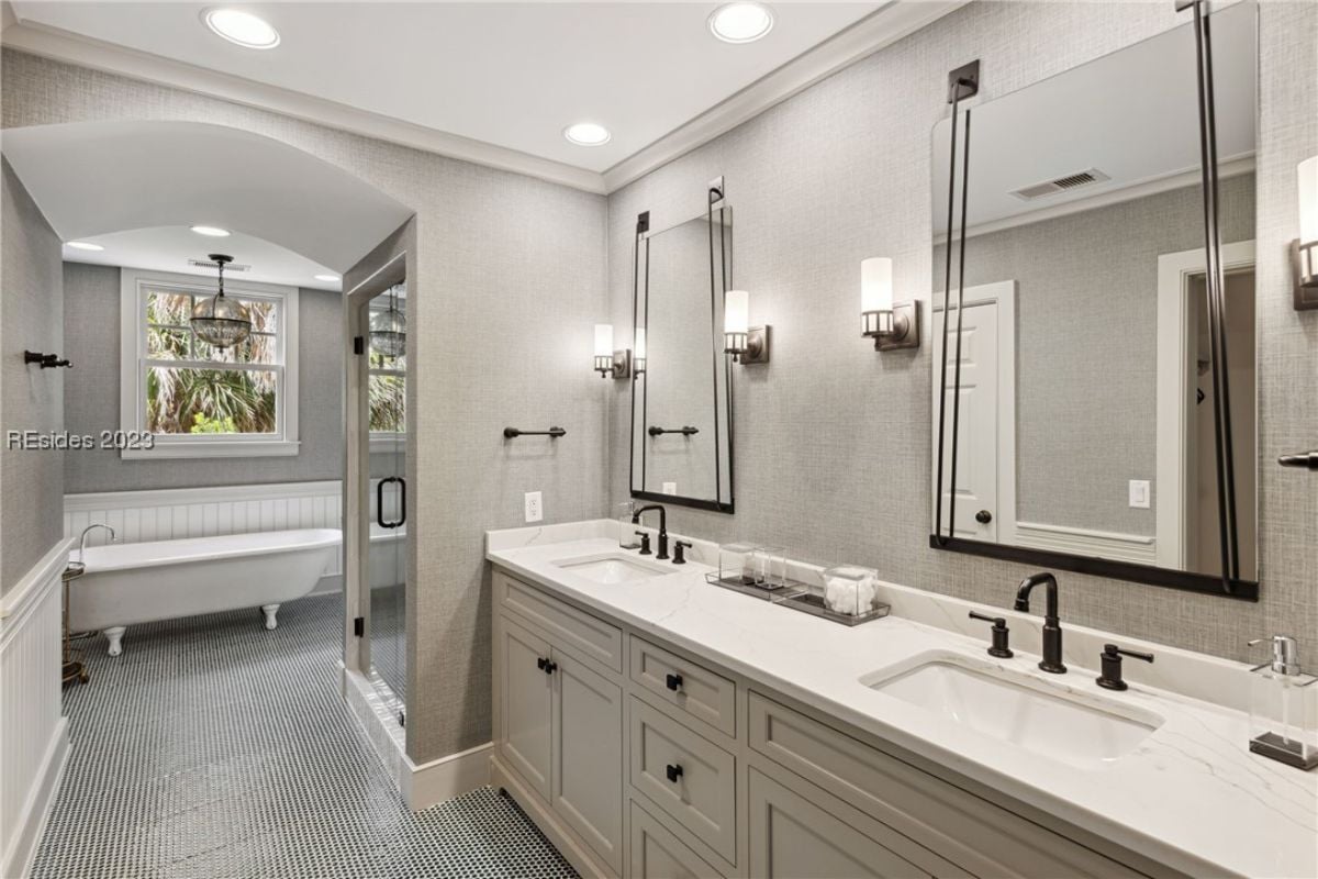 Bathroom with dual sinks, a soaking tub and a walk-in shower.