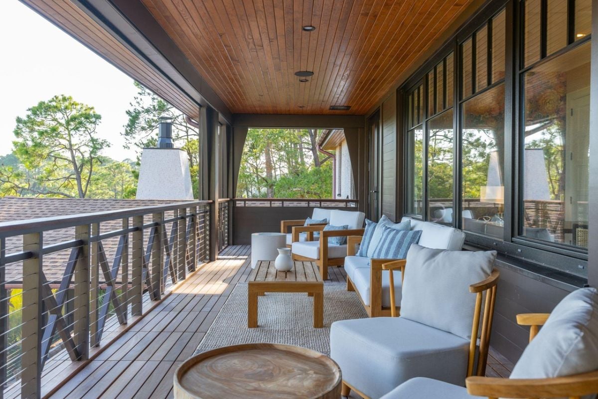 Balcony with tables and chairs.
