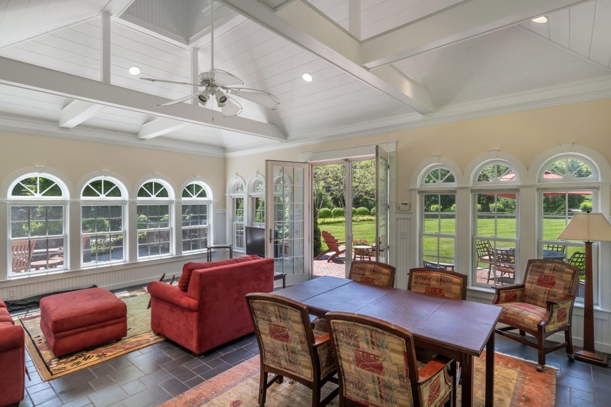 Guest house with a table, chairs and couches.