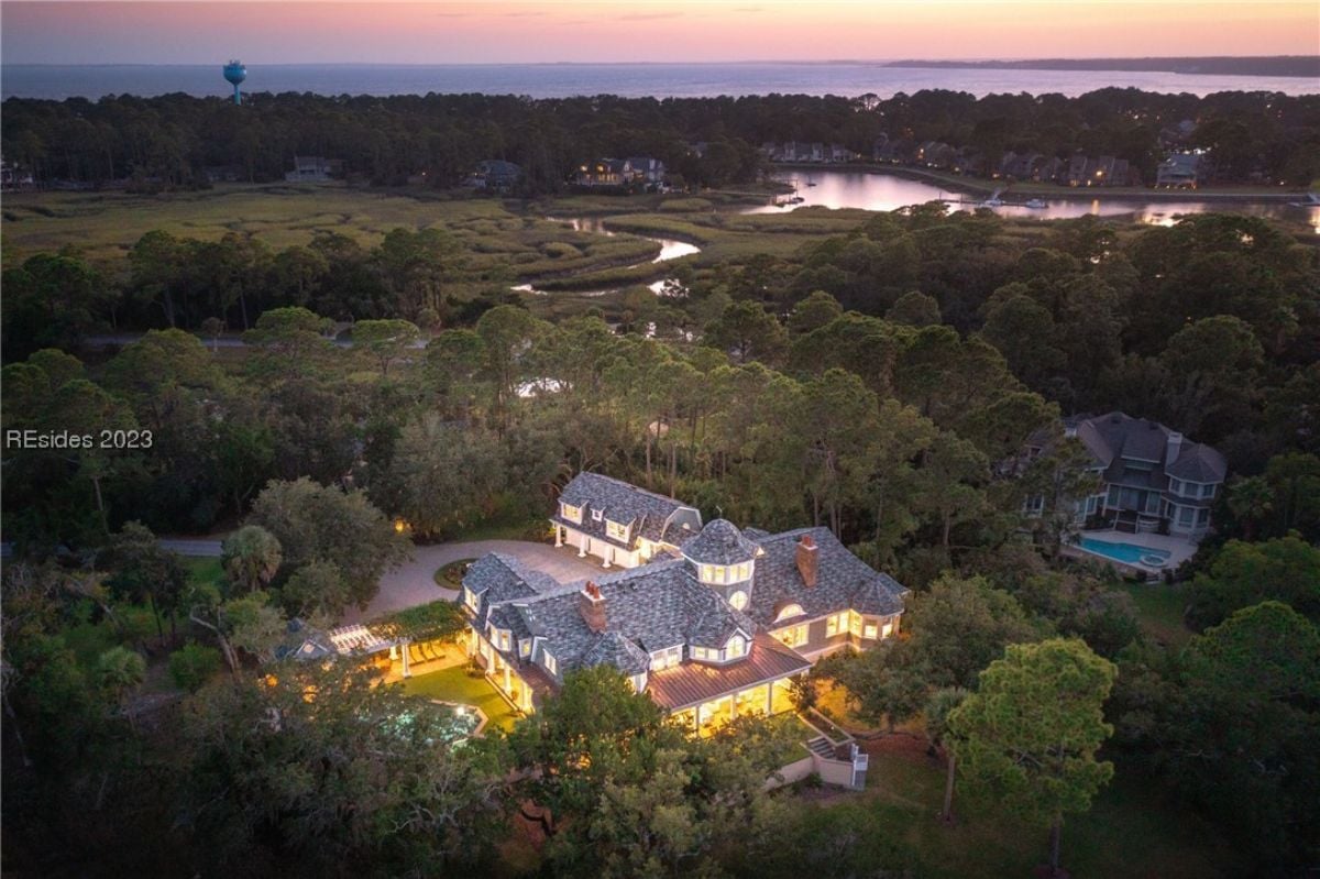 Aerial view of the property surrounded by trees.