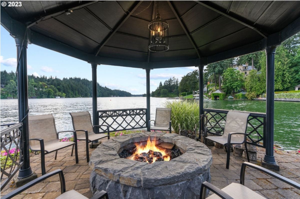 Fire pit with chairs overlooking the lake.