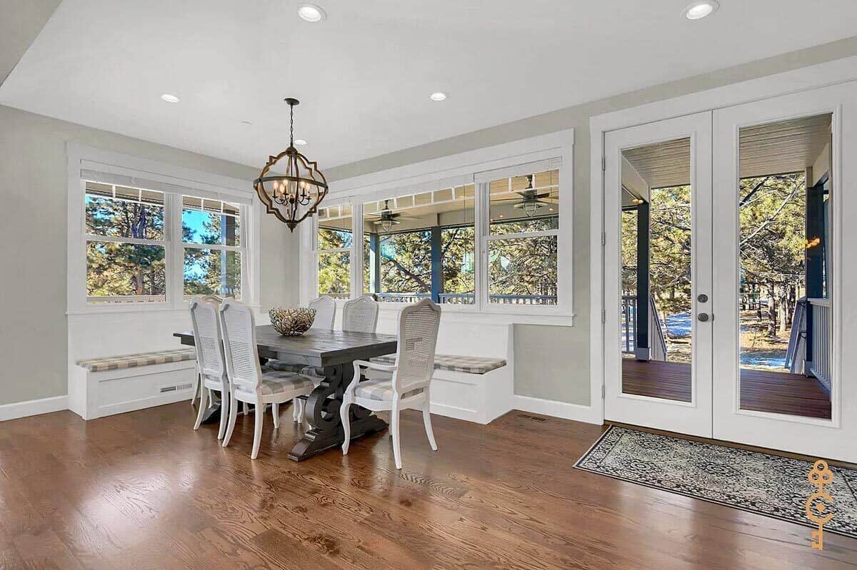 Dining area with banquette seating and a French door that opens to a covered patio.