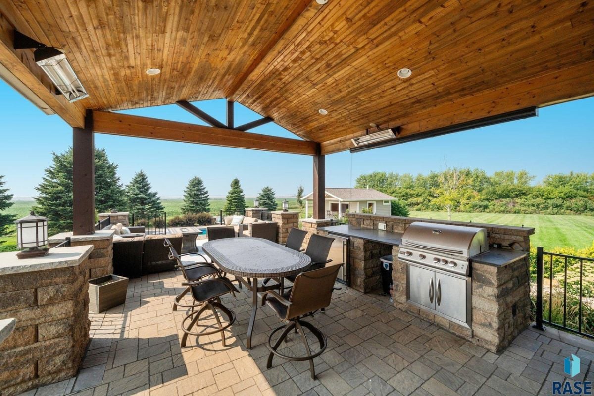 Grill area with a large table and chairs.