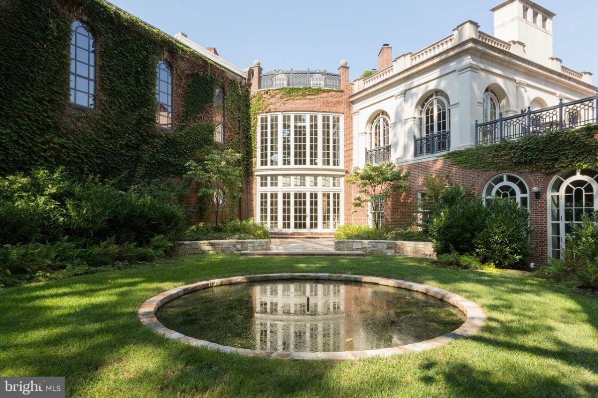 Courtyard of the property with a pond.