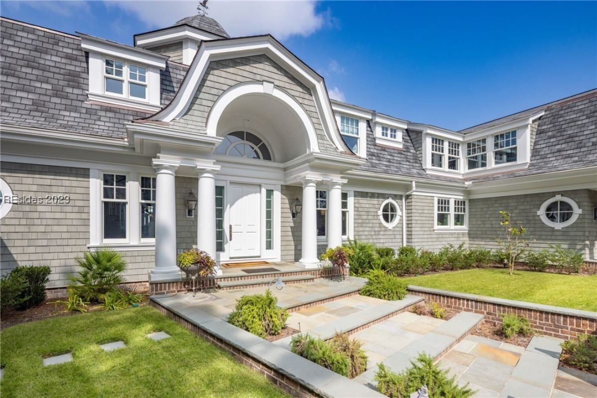 Front entry of the house with a landscaped front.