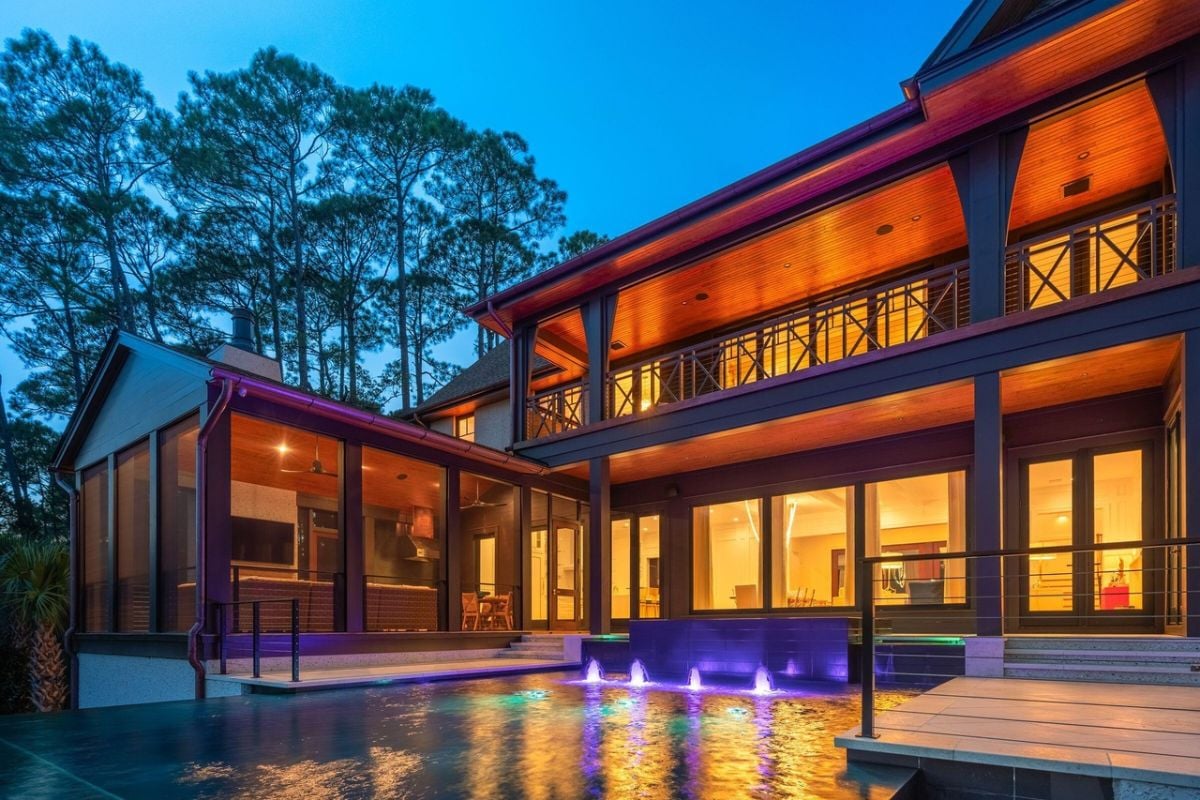 Rear view of the mansion with a pool.