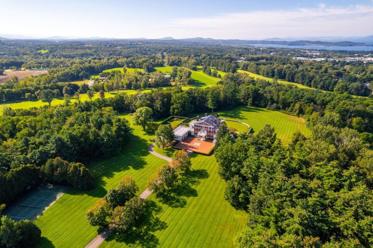 Aerial view of the property surrounded by trees.
