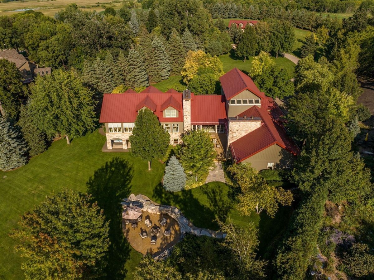 Aerial view of the house surrounded by trees.