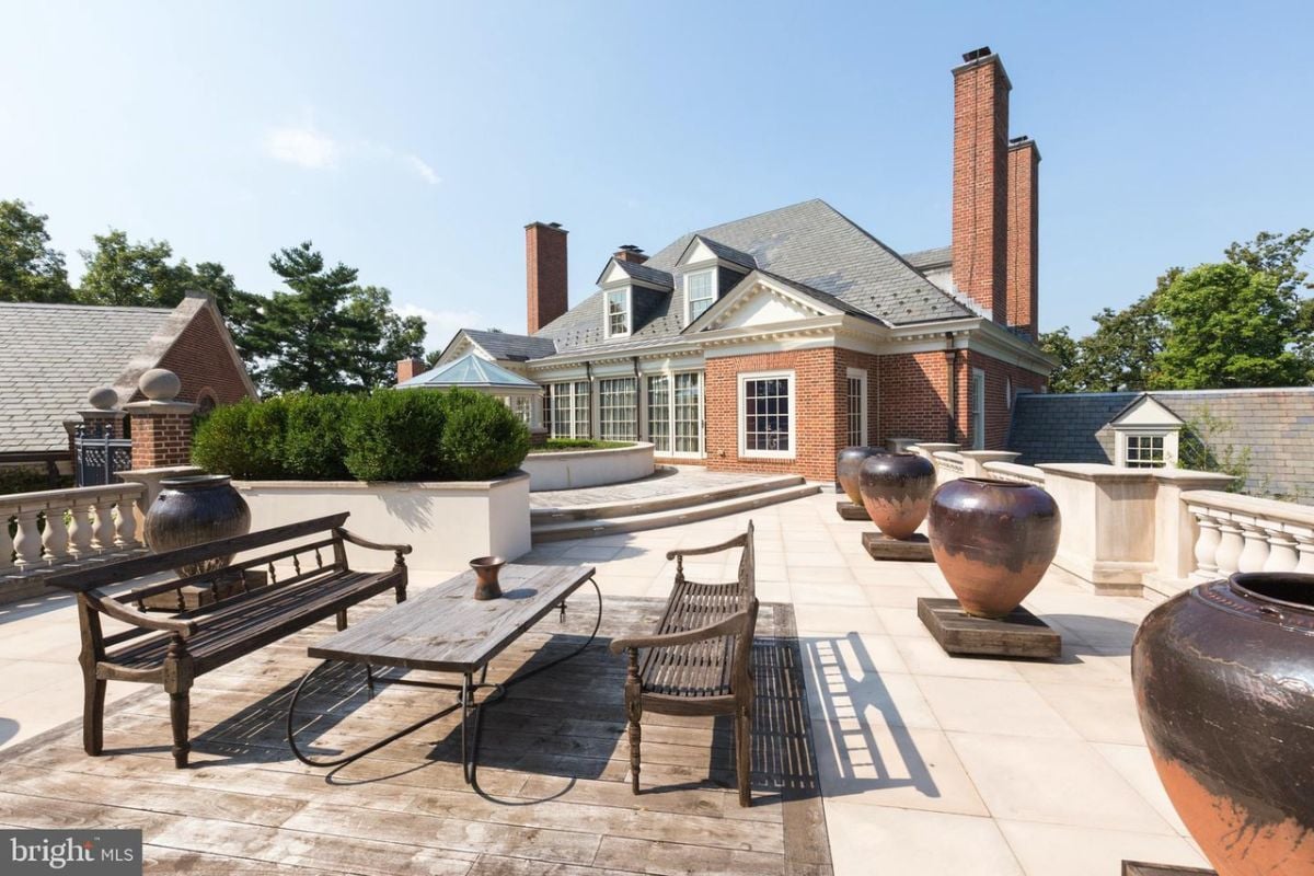 Patio with a table and benches.