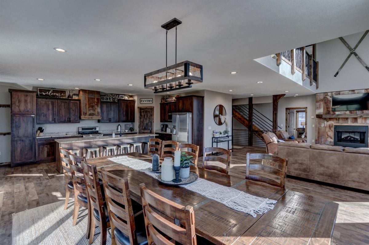 Dining room with a large wooden table and chairs.