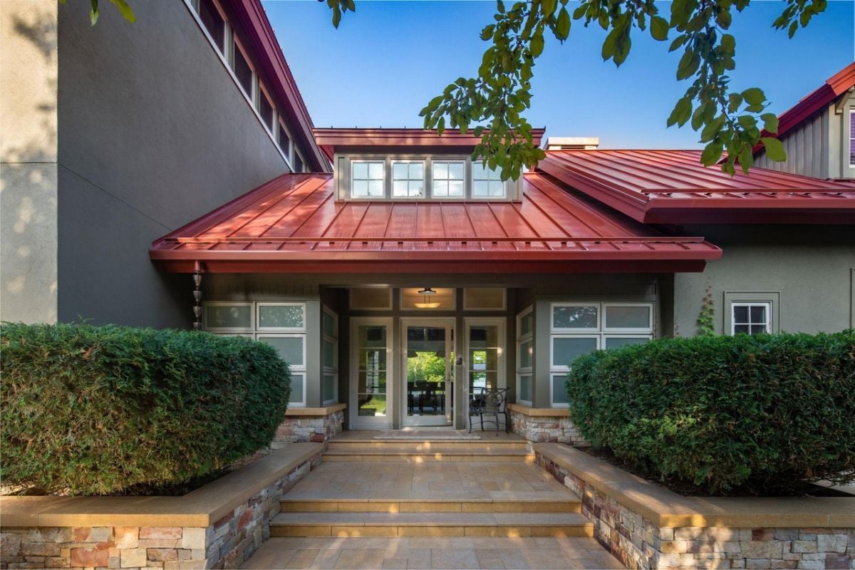 Front entry of the house with glass doors.