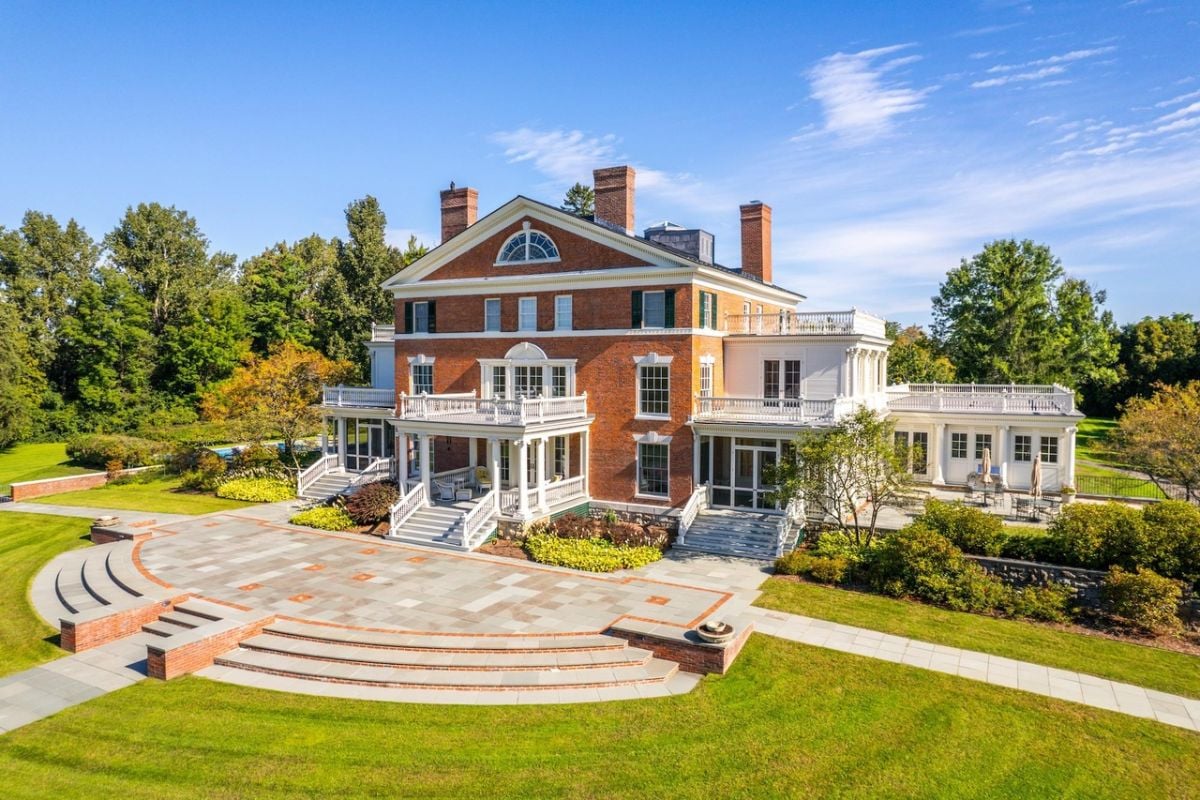 Front view of the house with a large lawn.