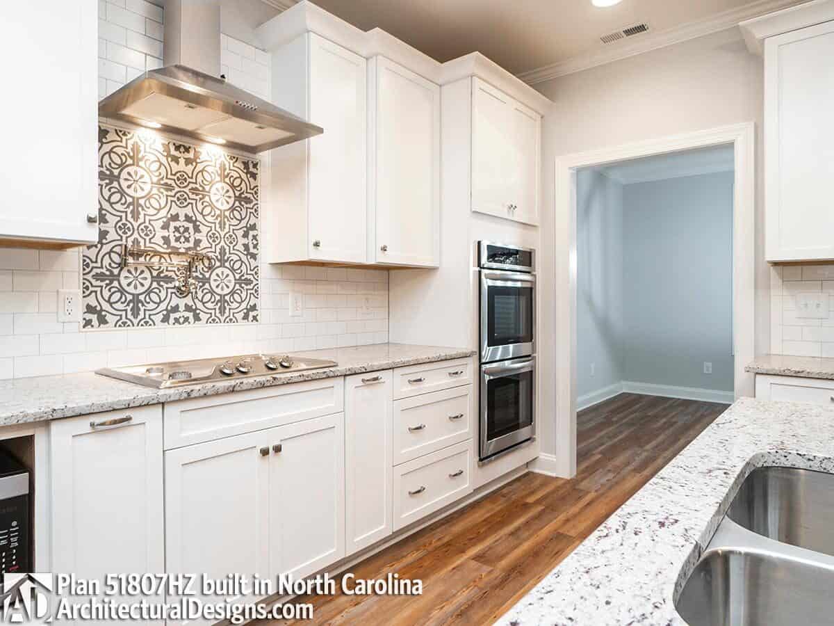 The kitchen includes high-end appliances and a shortcut to the formal dining room.