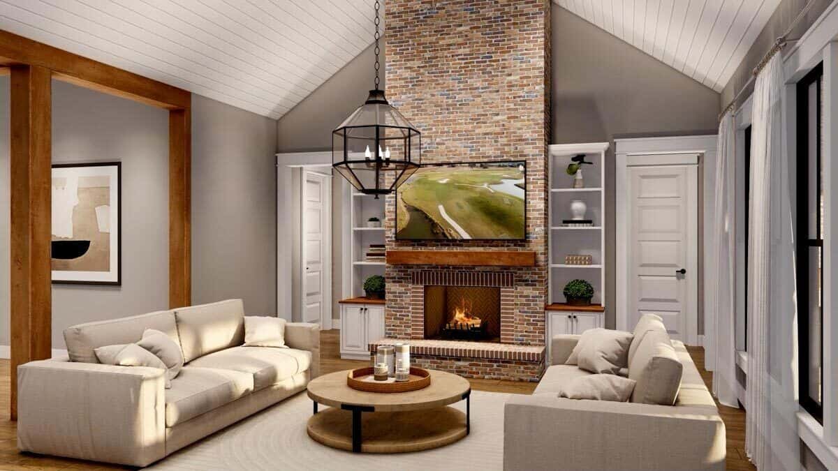 The great room includes a brick fireplace with a TV on top.