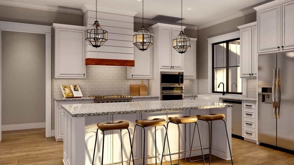 Kitchen with white cabinets, high-end appliances, and a center island with seating for four.