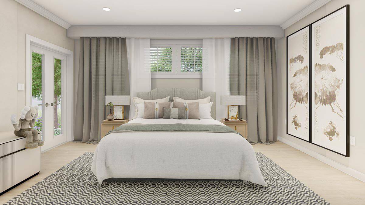Primary bedroom with an upholstered bed and a French door that opens to the back porch.