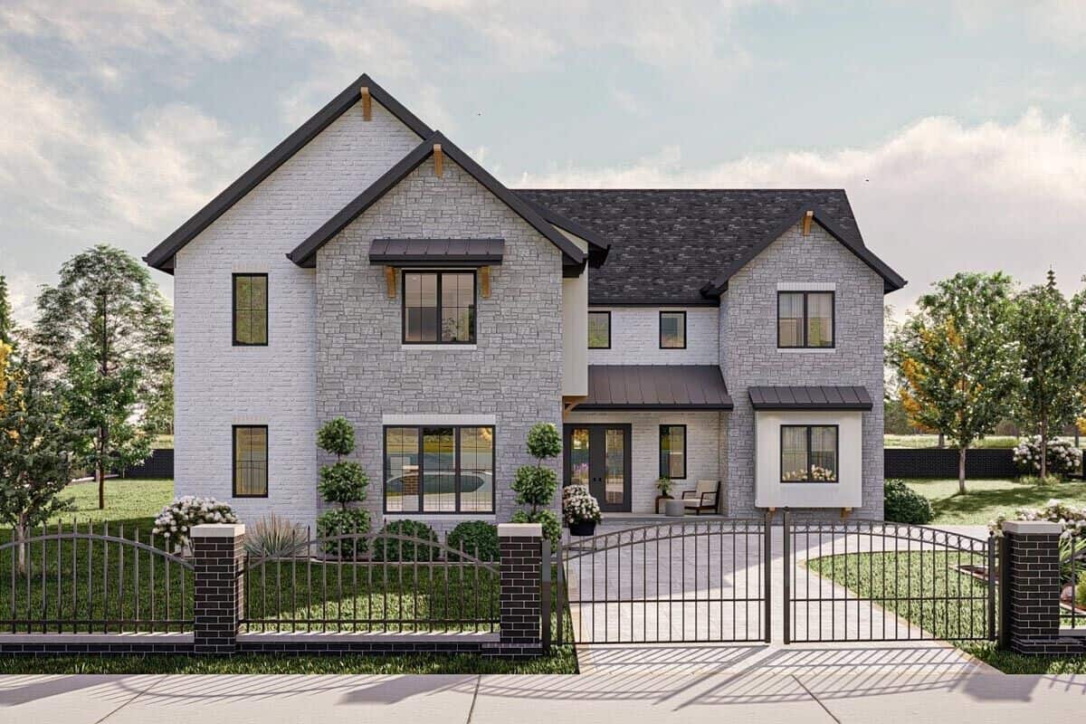 Front view with stone exterior, sliding windows, a French front door, and a side-entry garage.