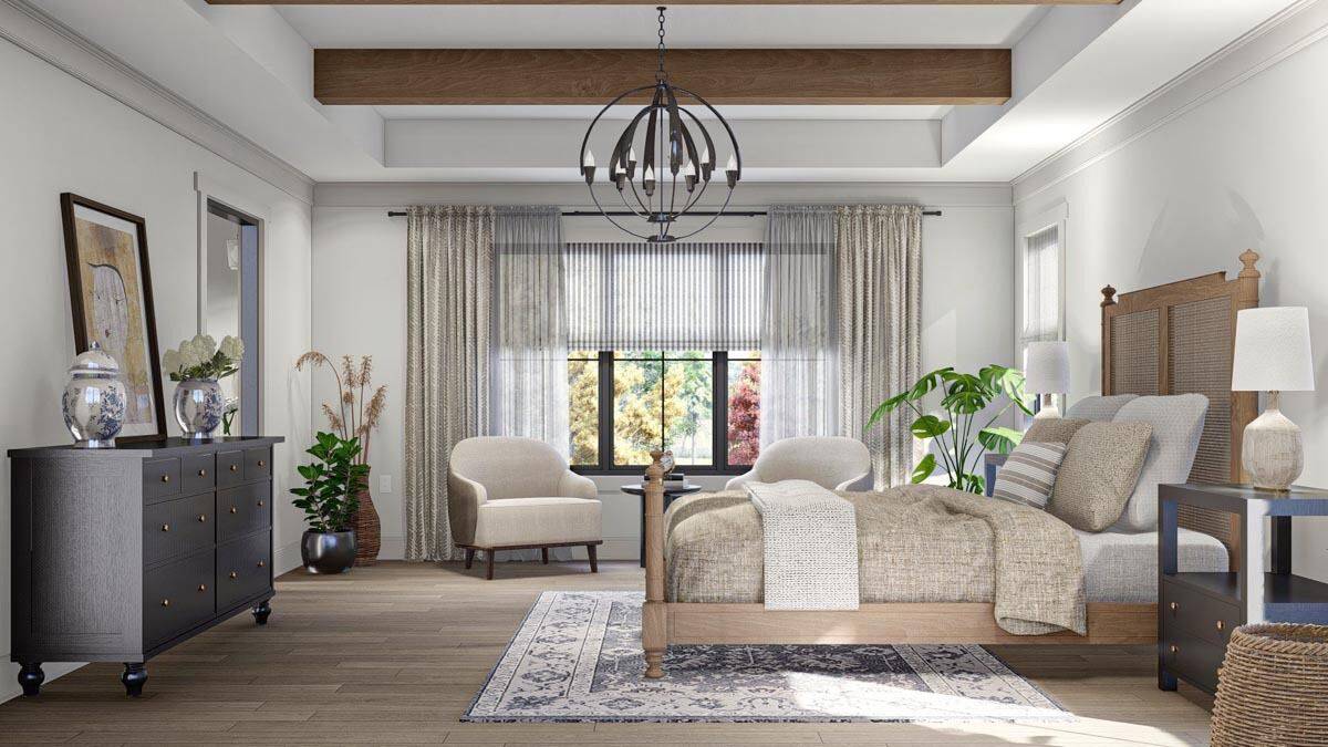 The primary bedroom includes a dark wood dresser and a sitting area by the windows.