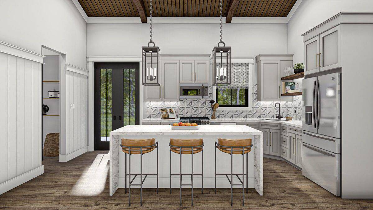 Kitchen with white cabinets, high-end appliances, and a waterfall island with seating for three.