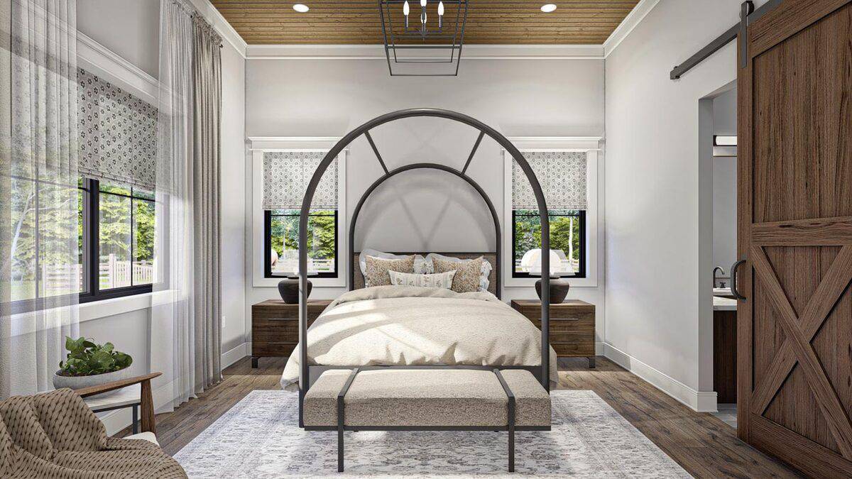 The primary bedroom includes a wood-paneled ceiling and an ensuite bath with a sliding barn door.