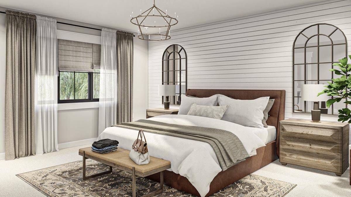 Primary bedroom with decorative arched mirrors and an upholstered bed complemented with a wooden bench.