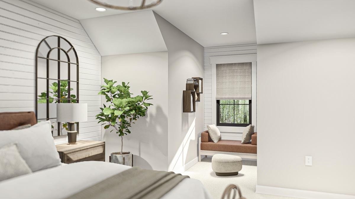 The primary bedroom includes a seating area by the dormer window.