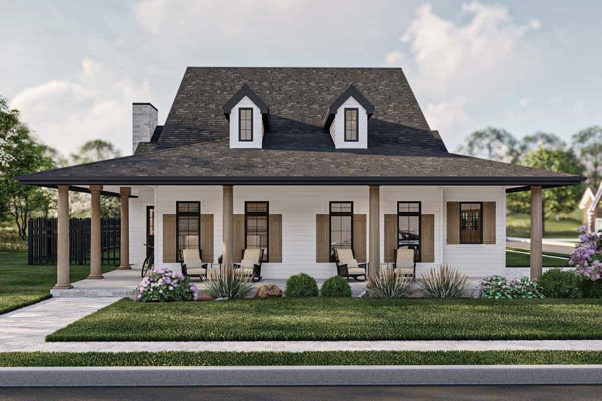 Front view of the house showcasing the L-shaped porch topped with twin dormers.