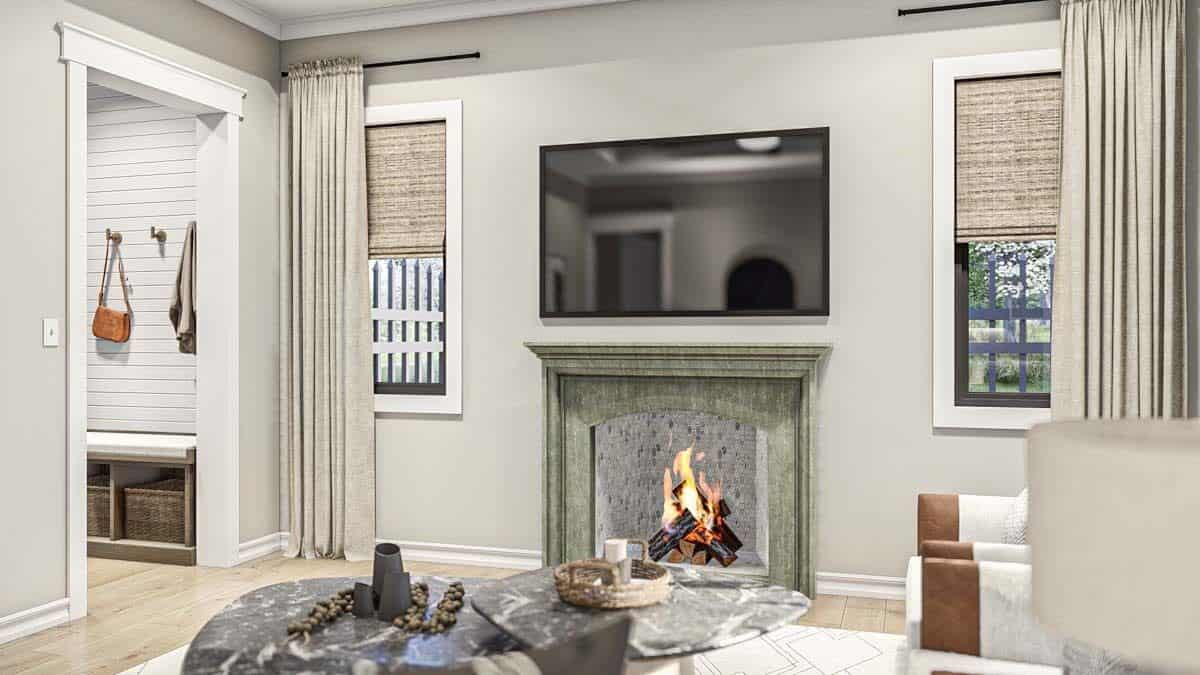 The great room includes a TV mounted above the fireplace.