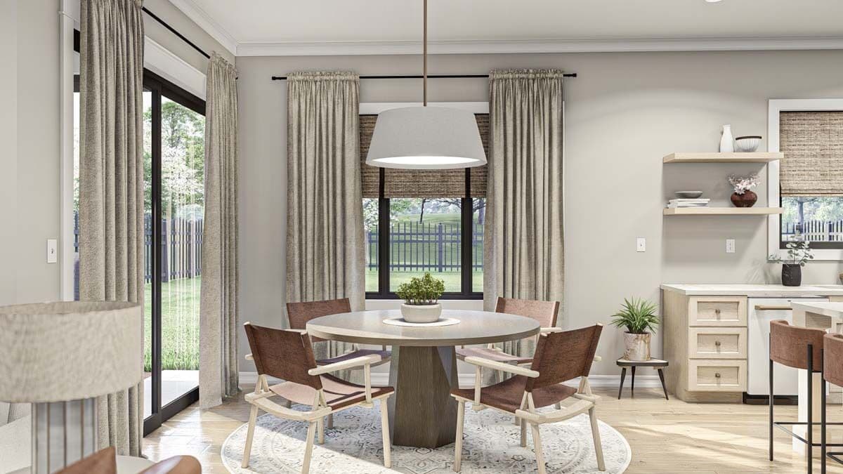 Dining room with a round dining set and sliding glass doors that open to a covered porch.