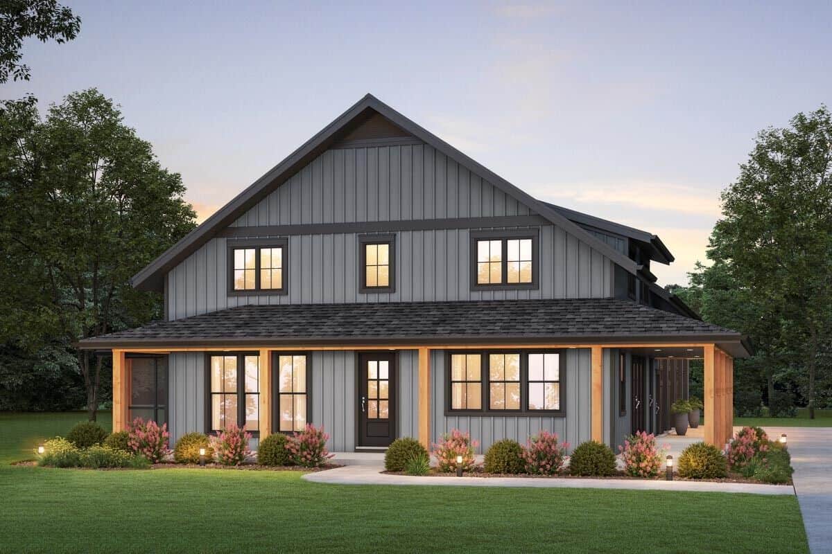 Front view of the house showcasing a wraparound porch and a glazed entry door.
