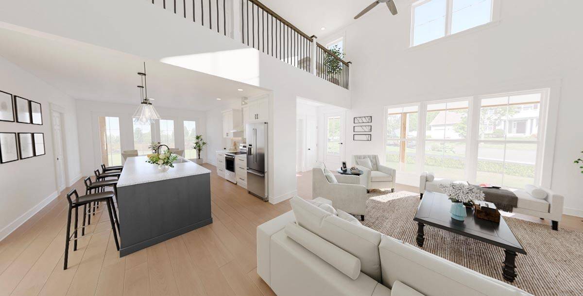 Great room and kitchen connected by a large opening.