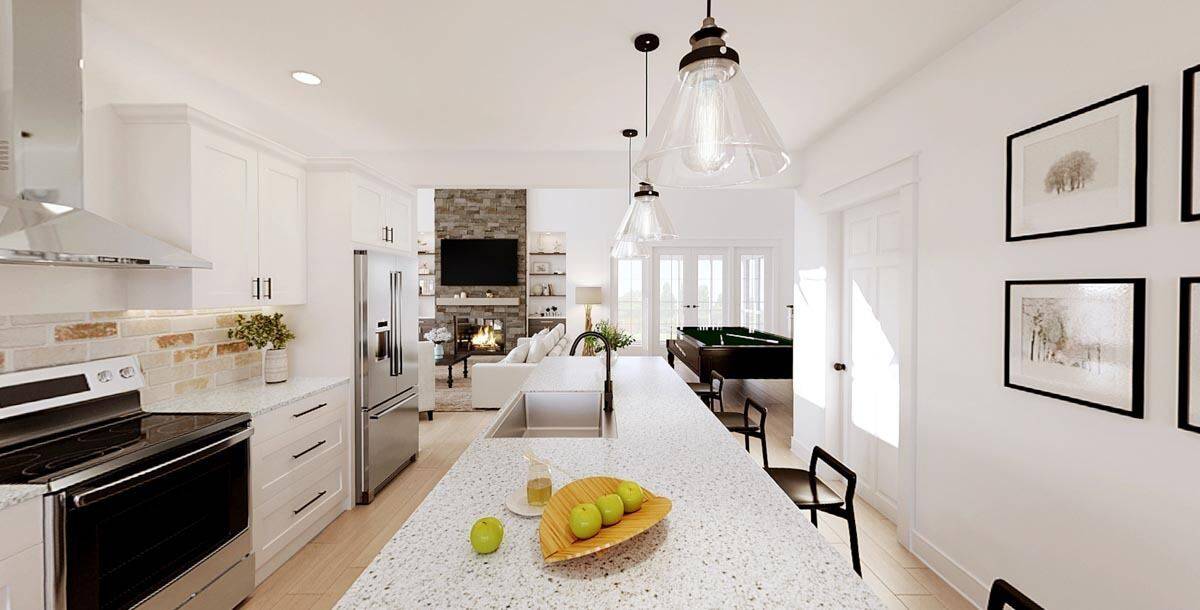 Glass pendants suspended over the island illuminate the kitchen.