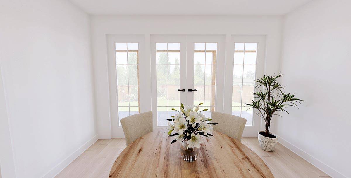 Dining room with a wooden dining set and a French door that opens to a covered porch.