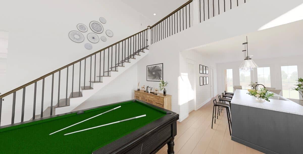 Rec room and kitchen with hardwood flooring and white walls.