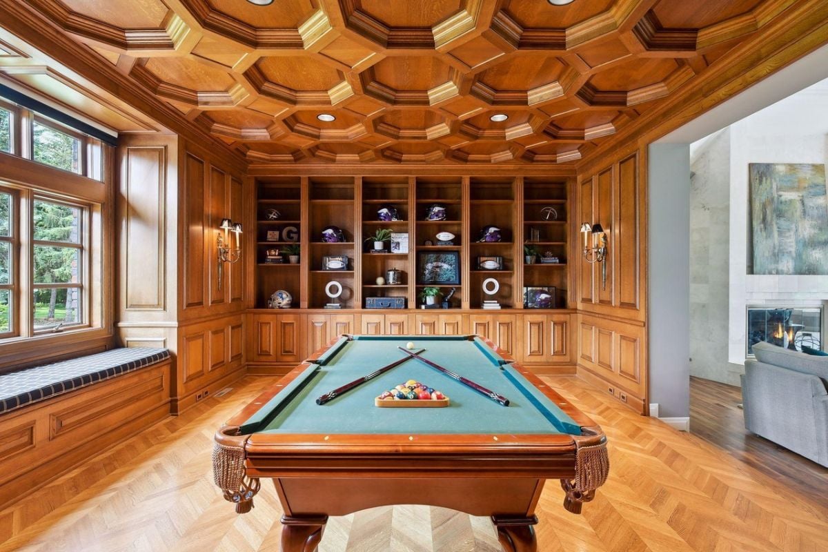 Billiards room with custom wooden cabinet.
