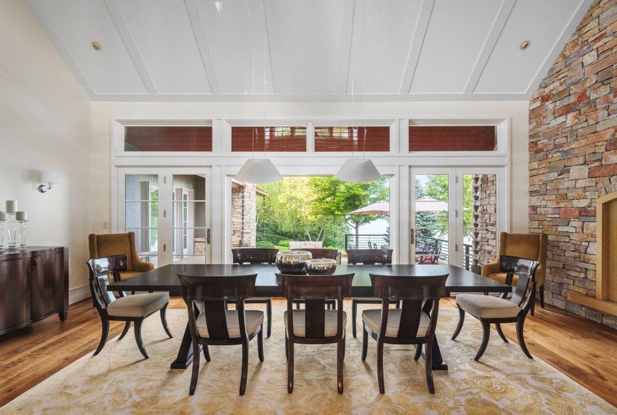 Dining room with a large wooden table and chairs.