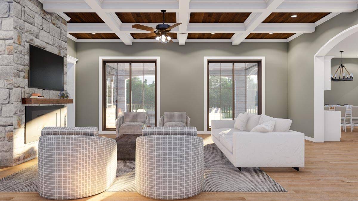 The great room includes huge rear windows overlooking the covered porch.
