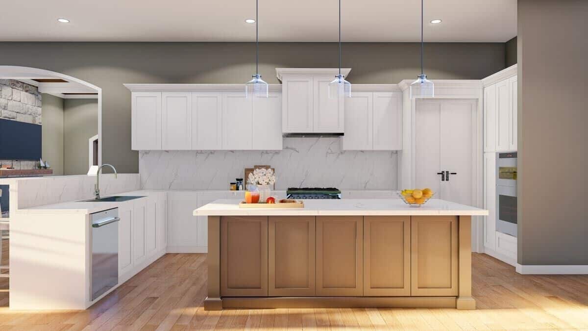 Kitchen with white cabinetry, marble countertops, and a center island that blends in with the hardwood floor.