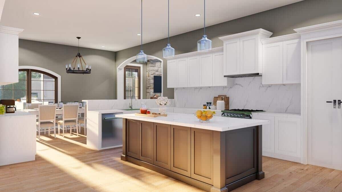 The kitchen includes a peninsula bar with a raised eating bar and an adjoining breakfast nook.